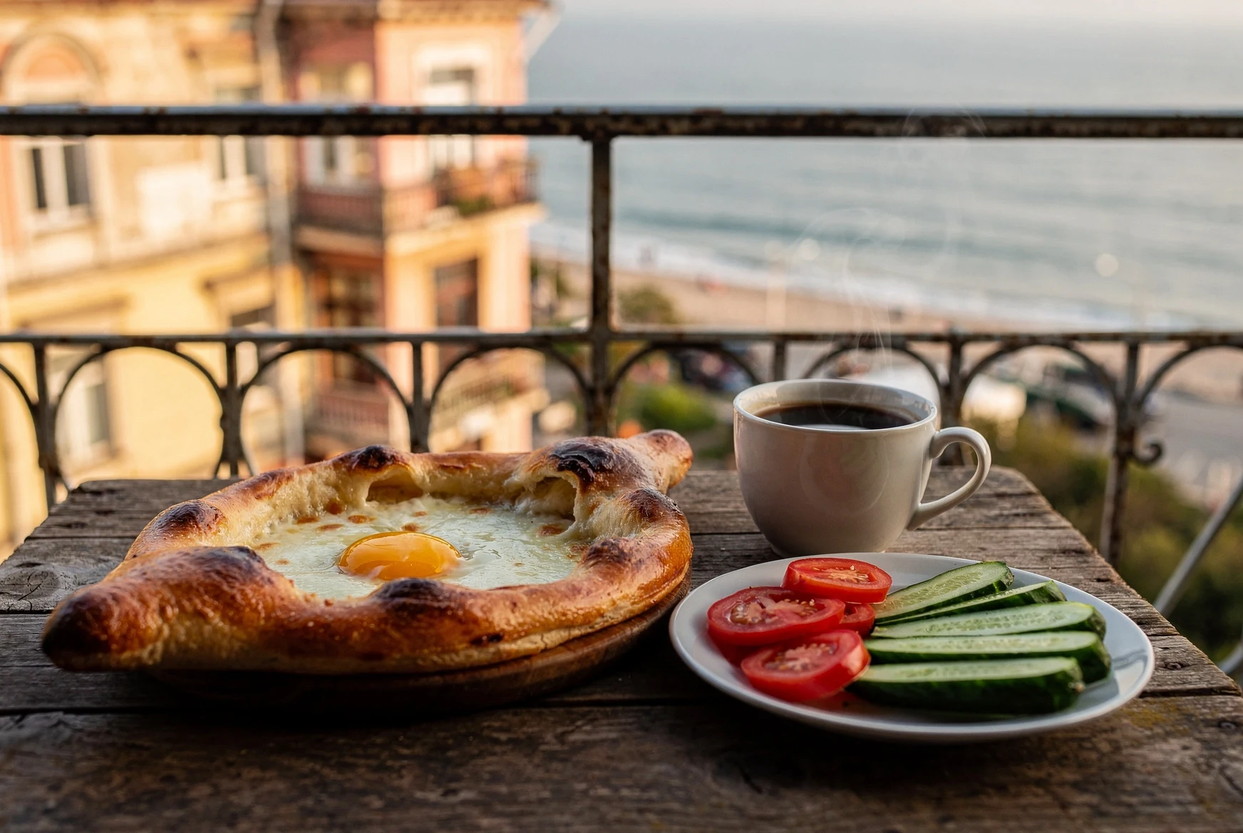 Breakfast table in a Batumi old town café with authentic Adjarian khachapuri and morning light