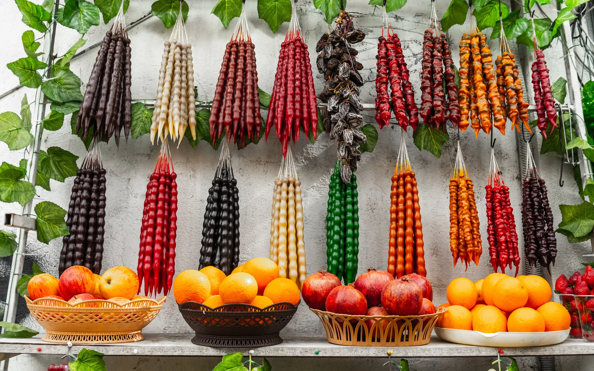 Strings of churchkhela hanging at a Georgian market stall