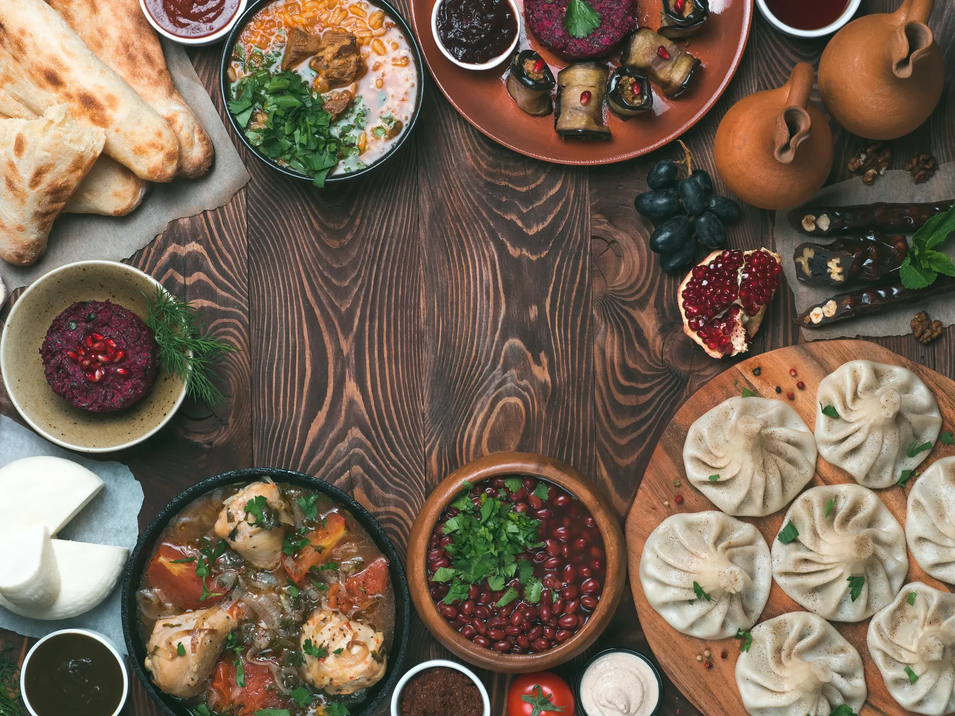 Overhead view of a traditional Georgian feast spread on a wooden table