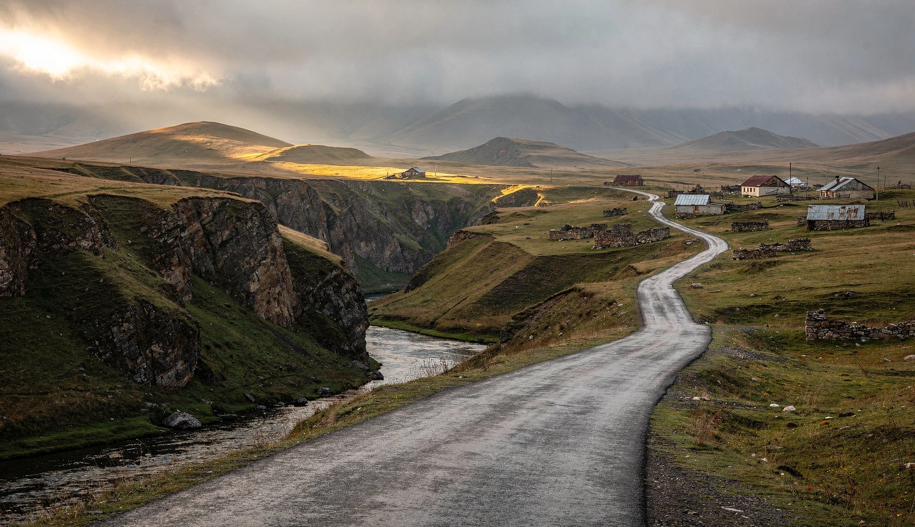Winding road through the high plateau of Samtskhe-Javakheti with rolling grasslands and volcanic hills