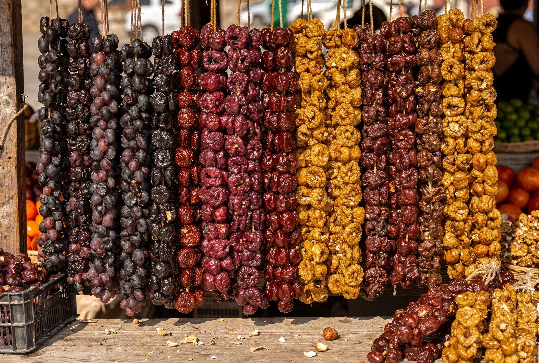 Colorful churchkhela hanging at a Georgian market stall