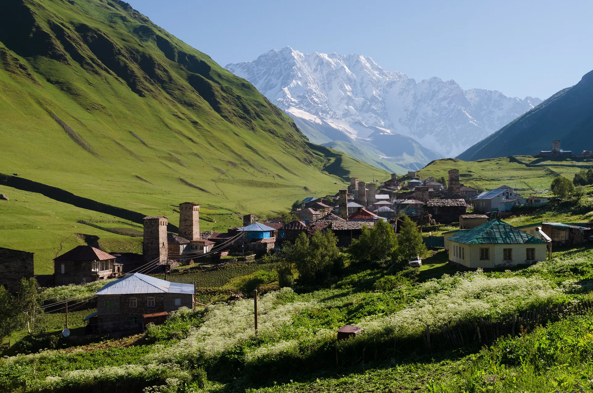 Ushguli village with medieval Svan towers and snow-capped mountains