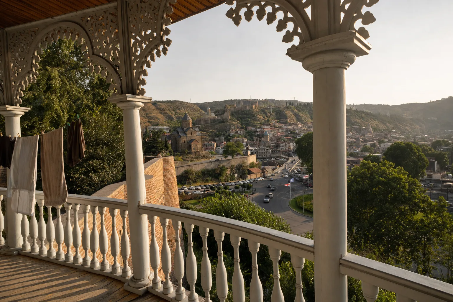 Cobblestone street in Tbilisi old town with traditional wooden balconies and warm afternoon light