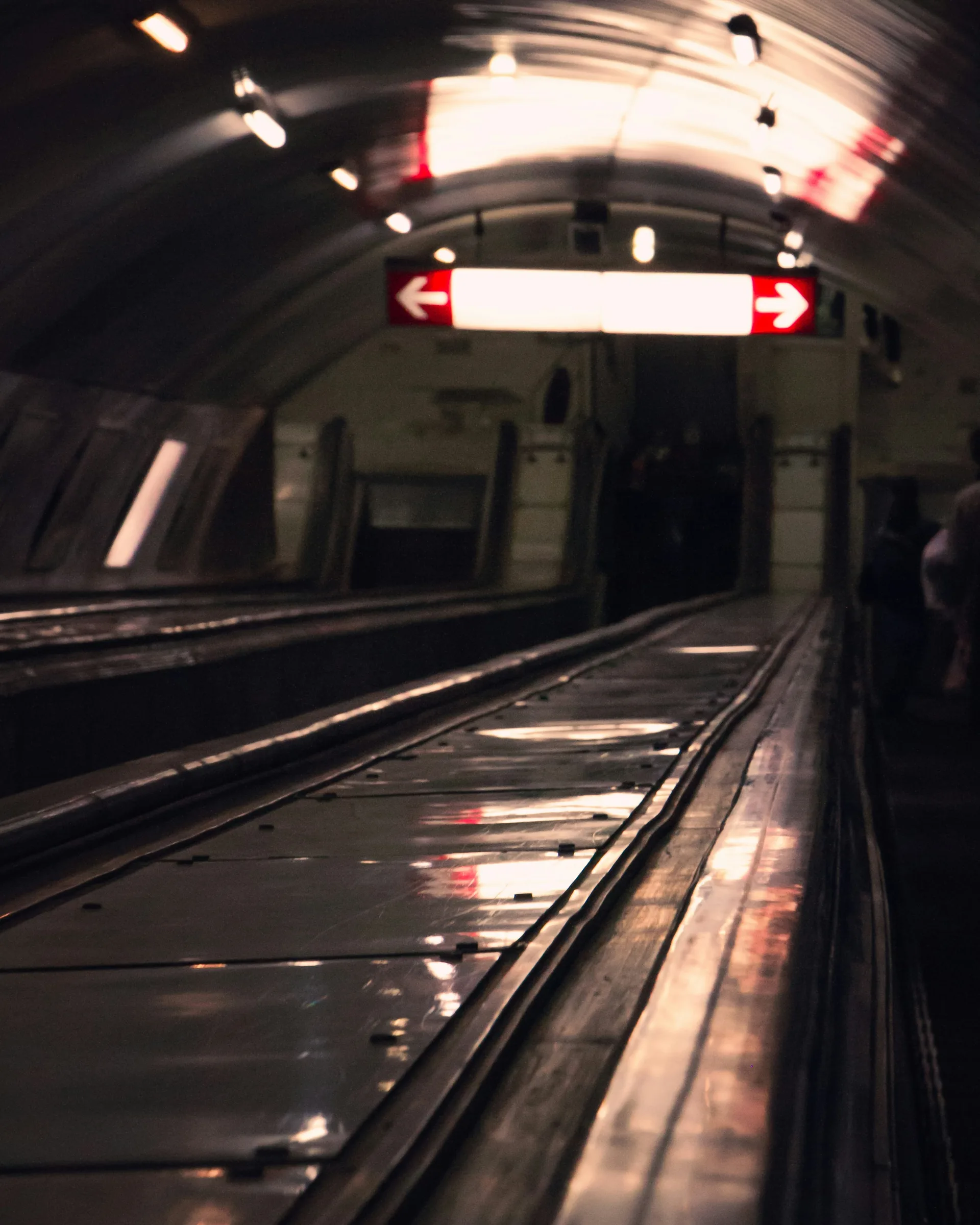 Tbilisi metro station escalators descending into the deep underground